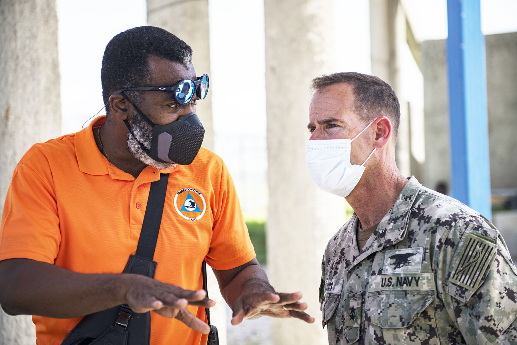 U.S. Navy Rear Adm. Keith Davids, right, U.S. Southern Command (USSOUTHCOM) Joint Task Force-Haiti commander, and Dr. Jerry Chandler, left, Director General at Direction Generale de la Protection Civile, discuss support at Port-au-Prince, Haiti, Aug. 21, 2021. U.S. Agency for International Development is the lead U.S. federal agency for foreign disaster assistance and USSOUTHCOM is supporting relief efforts. Photo: Tech. Sgt. Marleah Cabano